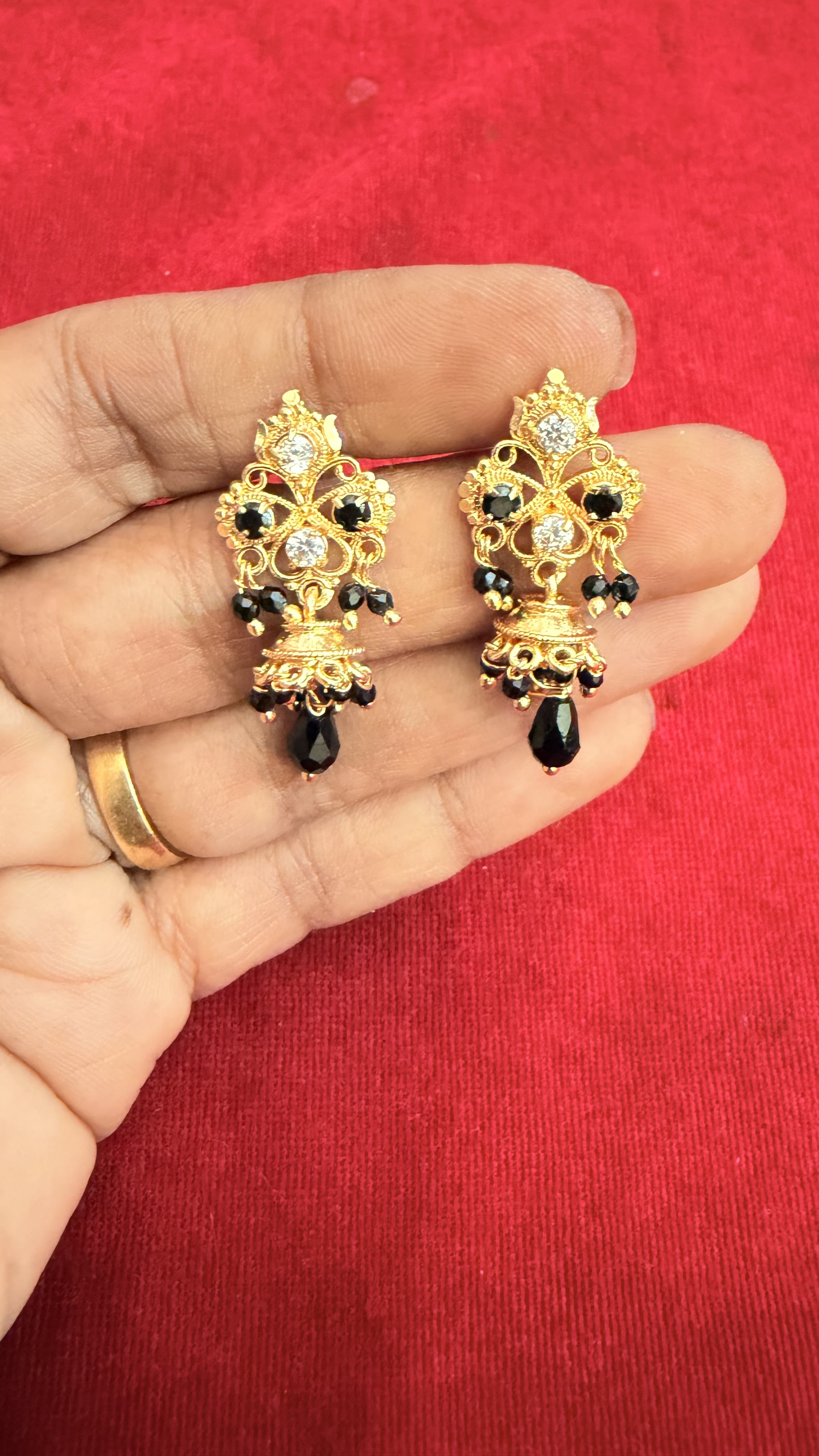 Black spinner earrings