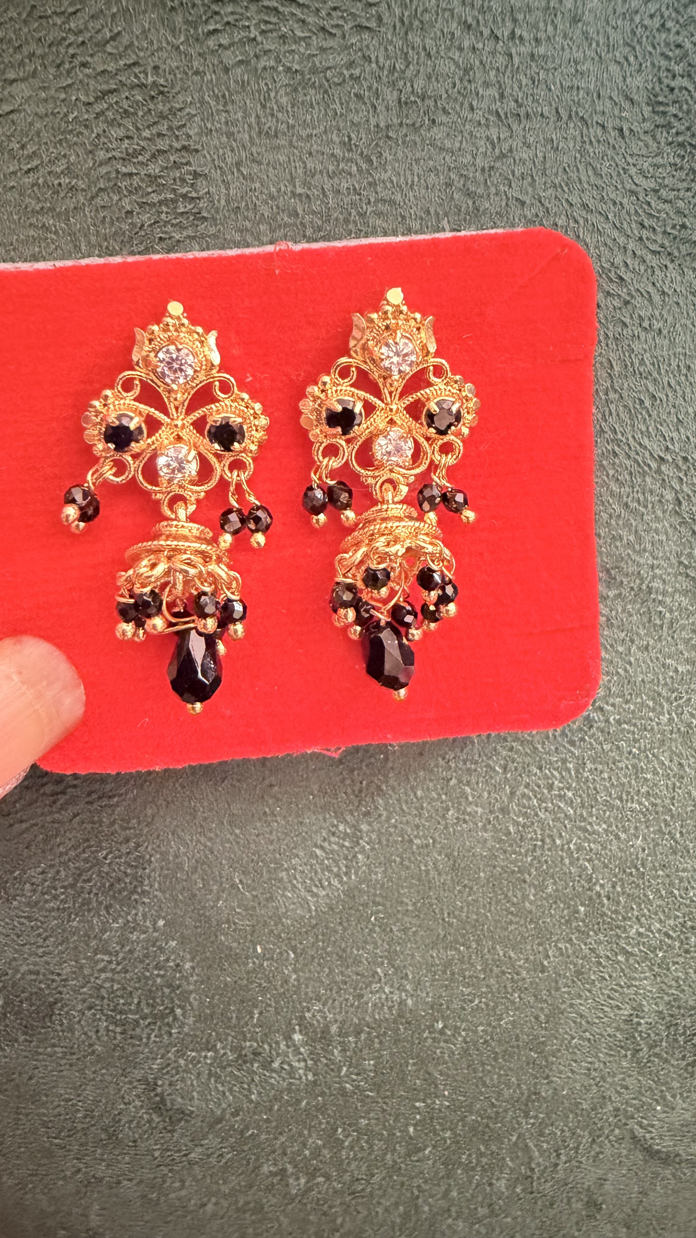 Black spinner earrings